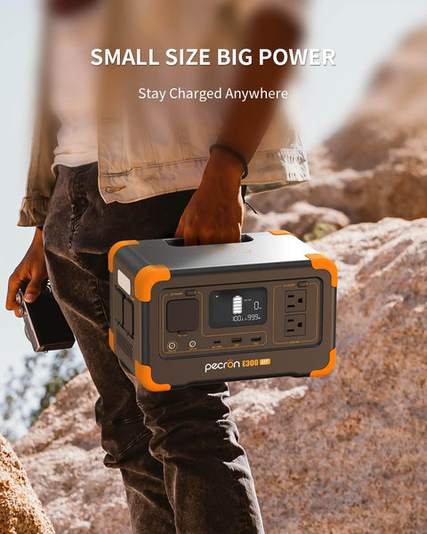 Person holding Go To Portable Power Station 288Wh LiFePO4 Battery With 600W Pure Sine Wave Inverter, rugged outdoor setting