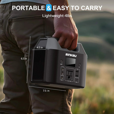 Person holding Go To Portable Power Station 122.8Wh LiFePO4 Battery Solar Generator with AC outlet, lightweight and compact for camping.