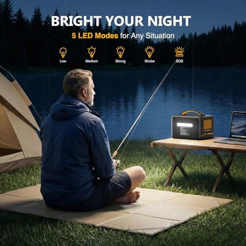 Person fishing at night next to Jump 1500X Portable Power Station With 110W Solar Panel Kit 828Wh LiFePO4 Battery Solar Generator on a table.