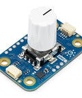 Modulino Rotary Encoder Knob With Built In Push Button for Precise Digital Control, shown on a blue circuit board.