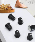 6 Pack 6mm D Type Potentiometer Knobs For 6mm Shafts Rubber Grip Guitar Volume Rotary Knobs Replacement, black knobs on table