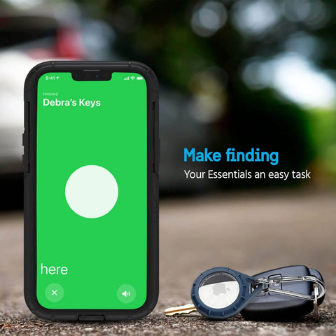 Smartphone showing AirTag location app next to keys with a Rugged AirTag Holder With Stainless Steel Carabiner Clip for various uses.