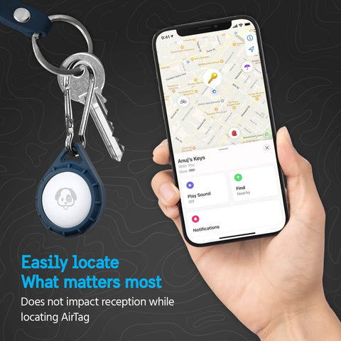 Person holding phone showing map, keys attached to Rugged AirTag Holder With Stainless Steel Carabiner Clip For Dog Collars Backpacks Keys And Luggage Impact Resistant Protective Case With Front Engraving Window Built For Travel And Everyday Carry Navy.