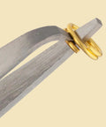 Split Ring Tweezers For Jewelry Making And Beading, Stainless Steel, 4.75 Inch Curved Precision Tip holding a gold split ring.