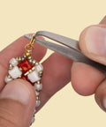 Using split ring tweezers for jewelry making and beading, stainless steel, 4.75 inch curved precision tip to attach charms without breaking nails.