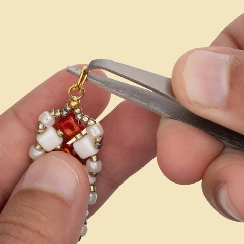 Using split ring tweezers for jewelry making and beading, stainless steel, 4.75 inch curved precision tip to attach charms without breaking nails.