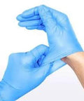Vinyl-nitrile examination gloves, blue, small, powder-free, being worn (close-up view)