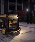 9000 Watt Tri Fuel Portable Open Frame Inverter Generator with Electric Start and Quiet Technology on driveway at night