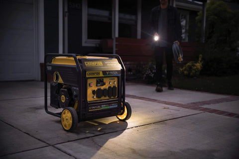 9000 Watt Tri Fuel Portable Open Frame Inverter Generator with Electric Start and Quiet Technology on driveway at night