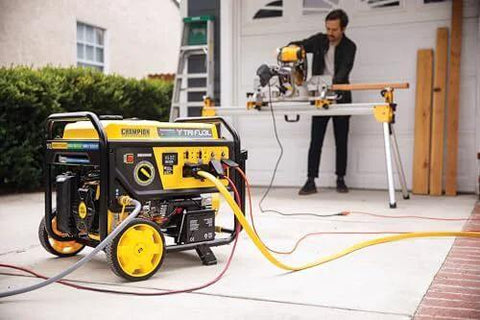 Tri Fuel 12,500-Watt Electric Start Portable Generator With CO Shield for Home Backup Power in use by man in garage setup