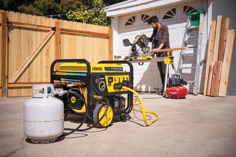 Tri Fuel 12,500-Watt Electric Start Portable Generator With CO Shield for storm backup, connected to propane tank