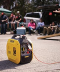 Ultralight 2500-Watt Portable Inverter Generator With Quiet Technology And CO Shield in use at a tailgating event