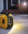Ultralight 2500-Watt Portable Inverter Generator with Quiet Technology on a driveway, perfect for home backup and camping.