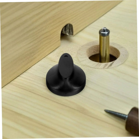 Black plastic Universal Timer Knobs Replacement for ovens, sterilizers, and rice cookers with precise timing, shown on wooden surface