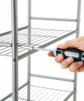 Using Seafoam 40-Piece Household Tool Kit for furniture assembly, featuring screwdriver for quick home repairs and DIY projects.