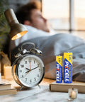 AA And AAA Battery Combo Pack, 24 AA And 24 AAA, 1.5V Carbon Zinc High Energy next to alarm clock on bedside table