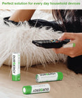 Person using remote with AA and AAA Battery Combo Pack 102 Count Alkaline 1.5V for remotes nearby
