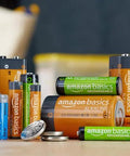 Various Amazon Basics batteries including AA Rechargeable NiMH Batteries 2000 mAh Low Self Discharge 1000 Recharges 8 Pack displayed on a table.