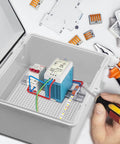 Person working inside Outdoor Electrical Enclosure Box IP67 Weatherproof Junction Box ABS Plastic Grey With 2 Cable Glands Hinged Cover 11.4 By 7.5 By 5.5 Inches Durable DIY Friendly Project Box For Routers Switches And Other Equipment.