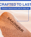 Close-up of Bed Sheet Tucker Mattress Lifter Tool Made From Sturdy Acacia Wood with Madera logo, highlighting craftsmanship