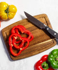 Must Have Acacia Wood Cutting Board With Juice Groove 8x6 Inch Small Kitchen Prep Board showing sliced red pepper and knife