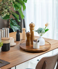 12-Inch Acacia Wood Lazy Susan Turntable Organizer For Cabinets, Pantries, Countertops with decor on a dining table