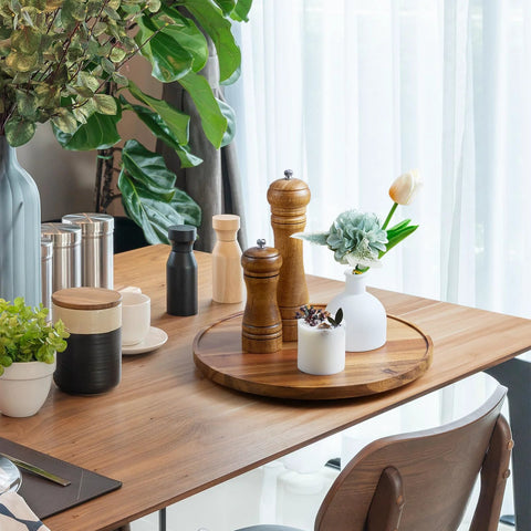 12-Inch Acacia Wood Lazy Susan Turntable Organizer For Cabinets, Pantries, Countertops with decor on a dining table