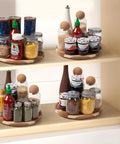 Acacia Wood Lazy Susan Turntable Organizer on shelves with spices, jams, and sauces, 8-inch round rotating serving tray display
