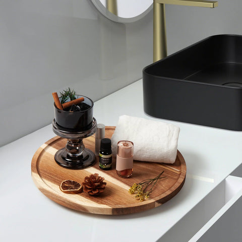 Acacia Wood Lazy Susan Turntable Organizer 8-Inch Round Rotating Serving Tray with aromatherapy bottles and towel on bathroom counter.
