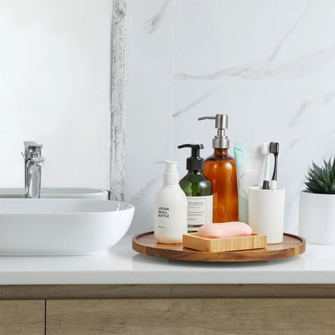 Bathroom setup with soap and dispensers on a 12-Inch Acacia Wood Lazy Susan Turntable Organizer for Cabinets, Pantries, Countertops.