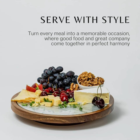 Close-up of 12 inch acacia wood lazy susan turntable with removable glass plate, featuring assorted cheeses and fruits.