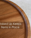 Close-up of Acacia wood lazy susan organizer designed for kitchen and pantry use, featuring a raised lip for stability.