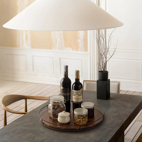 18-Inch Acacia Wood Lazy Susan Turntable with Metal Frame on dining table, featuring jars and wine bottles, for charcuterie and cheese board setup.
