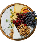 12 inch acacia wood lazy susan turntable with removable glass plate featuring assorted cheeses and fruits.