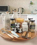 18 inch acacia wood lazy susan cabinet organizer with spices and condiments on kitchen counter.