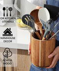 Person holding Acacia Wood Utensil Holder for kitchen countertop with 360 degree rotating base, farmhouse style