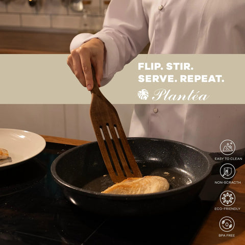 Person using Spurtle Kitchen Tools Wooden Set For Nonstick Cookware to stir food in a pan, showcasing heat resistance and non-scratch qualities.