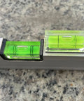 Magnetic Square Bubble Spirit Levels Set 3 Pack Mini Acrylic Level Tool For Precise Horizontal And Vertical Alignment With Pro Grade Magnetic Backing Handy And Reliable For Turntables And DIY Projects LAIESYA displayed on stone surface.