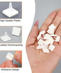 Hand holding Sticky PCB Spacers 100Pcs Adhesive Insulated Standoffs for PC Boards and Computer Motherboards 0.25 Inch Height