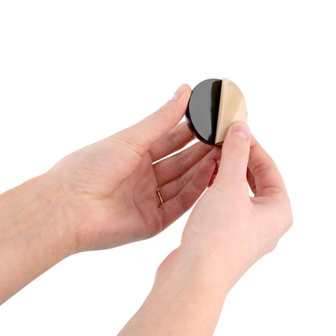 Person holding One Inch Hemisphere Rubber Bumpers With Adhesive Backing For Vibration Isolation And Shock Dampening, 8 Pack.