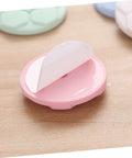 Close-up of a pink protective pad with adhesive backing, part of the Protective Pads For Washing Machine And Home Use 5 Pack.
