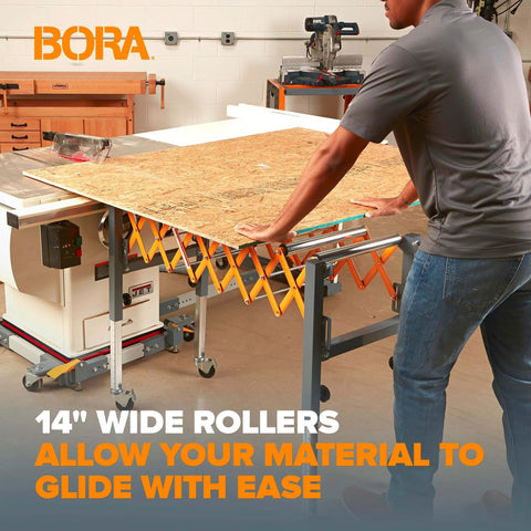 Person using Adjustable Conveyor Roller Stand with 14-inch wide rollers in woodworking shop, smoothing plywood movement.