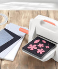 Adjustable Die Cutting And Embossing Machine With Six And One Quarter Inch Feeding Slot For Six Inch Paper And Other Materials Height Adjustment Gear System For Easy Projects By Bira Craft on wooden table with dies