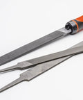 Adjustable universal file handle clamps to tool tang and fits multiple file sizes without inserts with metal files on a white background.