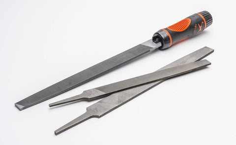 Adjustable universal file handle clamps to tool tang and fits multiple file sizes without inserts with metal files on a white background.