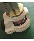 Close-up of ✝️ 2.36" inch Adjustable Height Floor Lock Heavy Duty Caster Wheel 60mm - M12 Threaded stem on green surface.
