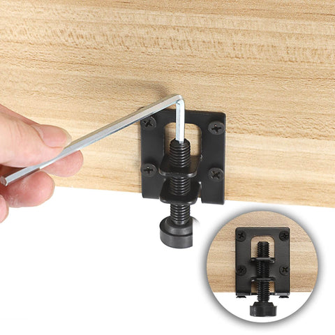 Installing four-pack adjustable L shaped furniture leveling feet with heavy duty brackets on a wooden surface using a hex wrench.