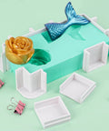 Adjustable Molds Housing For Silicone And Resin Molds shown with reusable plastic frame, binder clips, and decorative mold pieces.