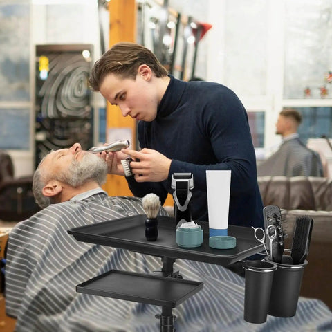 Barber using On Wheels Salon Tray Cart With Adjustable Height And Storage Platform Aluminum And Iron Rolling Tray for grooming.