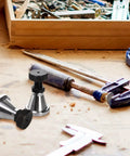 Two pack adjustable screw jack set provides precise leveling for milling and drilling machines, height adjustable from 2.75 to 4.25 inches, 2 inch diameter, 5 ton capacity, rugged 45 steel for stable, reliable support shown in a workshop.